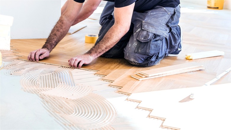 putting hardwood on glued floor