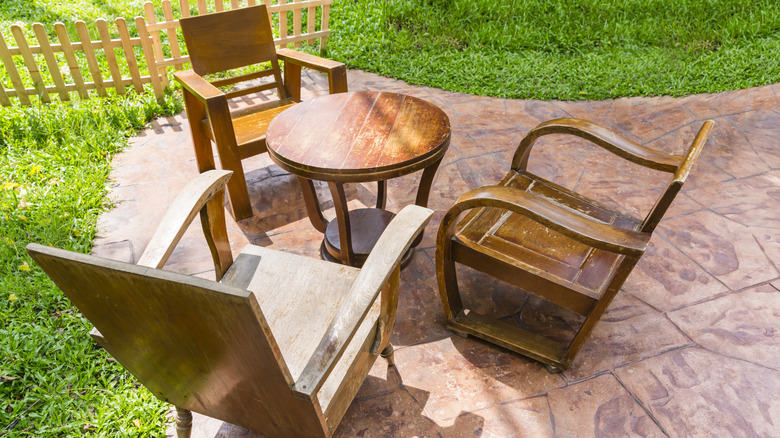 Weathered and unfinished outdoor wood furniture