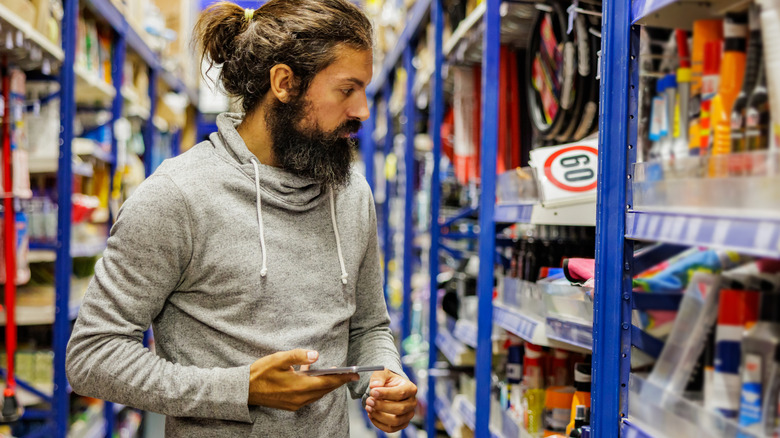 Man shopping for tools in a hardware store
