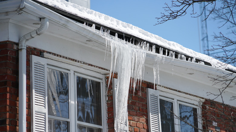 House with bent gutter because of ice