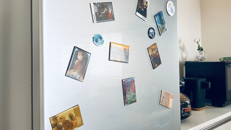 Collection of art magnets on a fridge