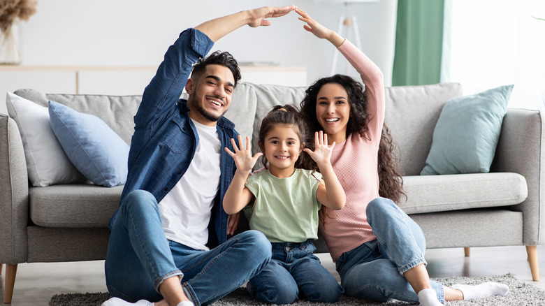family sitting on floor