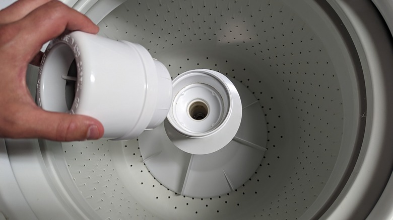 Removing top-load washing machine agitator headpiece