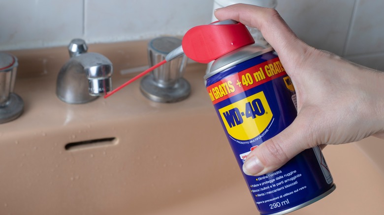 WD-40 applied to bathroom faucet