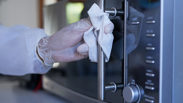 hand cleaning microwave handle