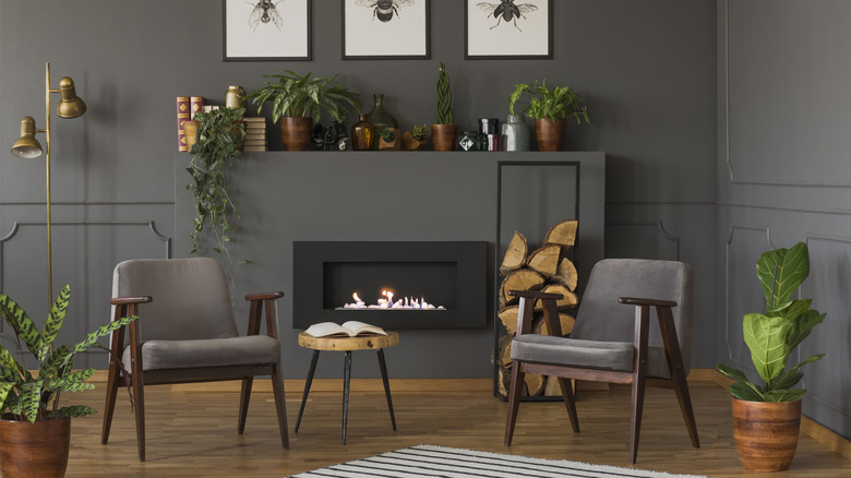 A living room with cluttered mantel