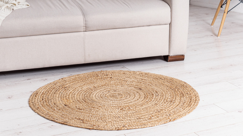 Spiral jute rug in front of couch