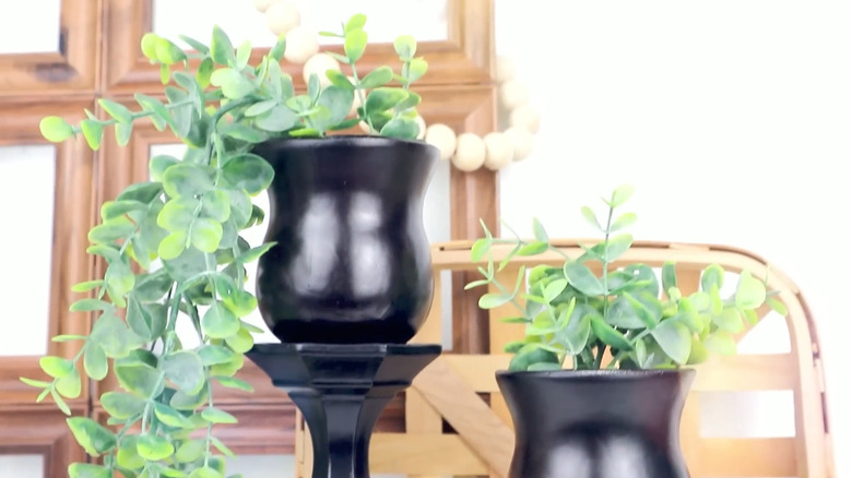 Elevated planters for artificial plants made from vase glued on top of a Dollar Tree candle holder