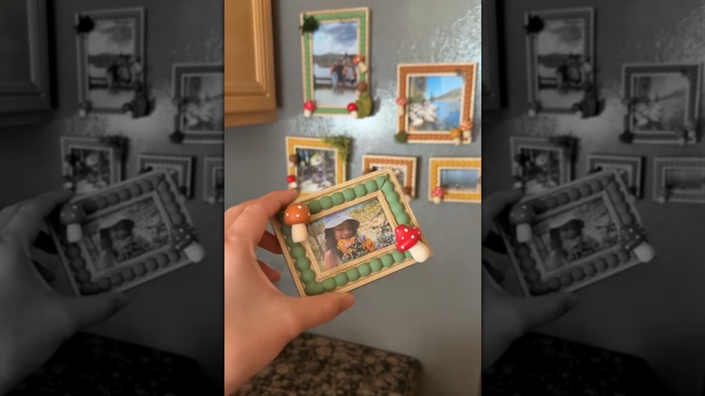 A hand holding a cottagecore frame