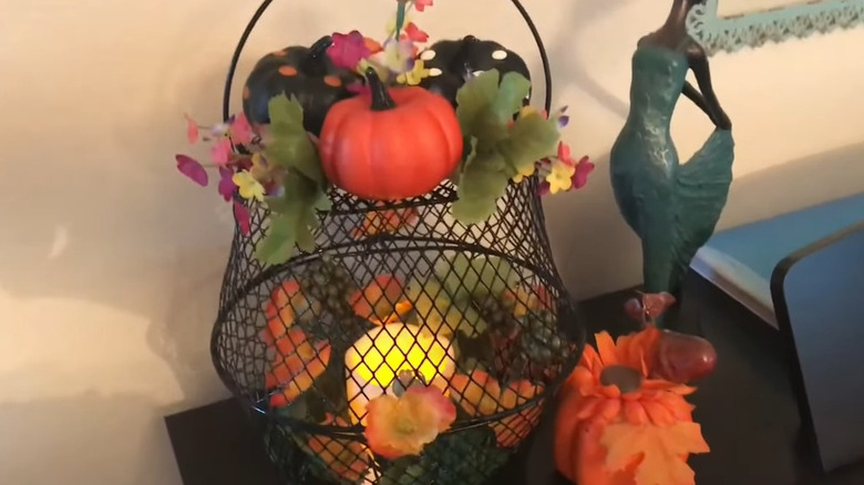 a fall centerpiece lantern made from Dollar Tree items
