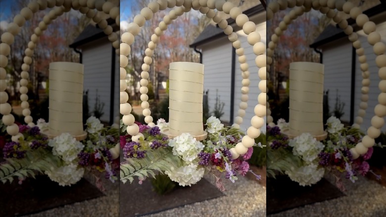 a whimsical porch hanging made from dollar tree items