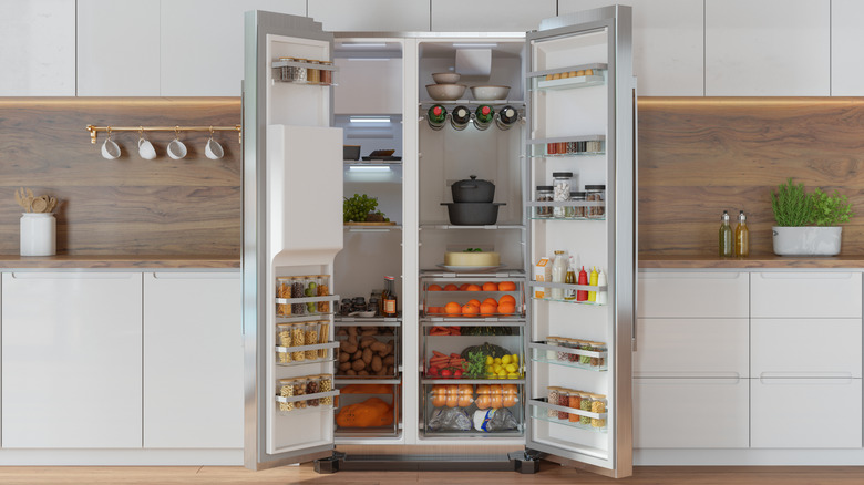An open refrigerator stocked with food
