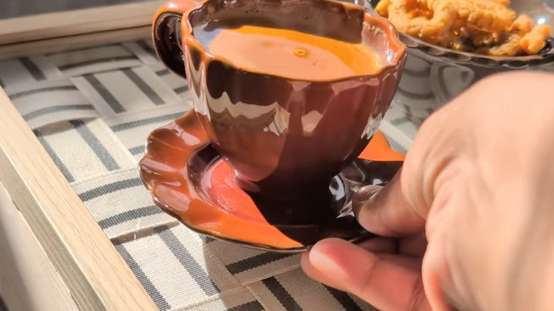 DIY armrest tray with coffee