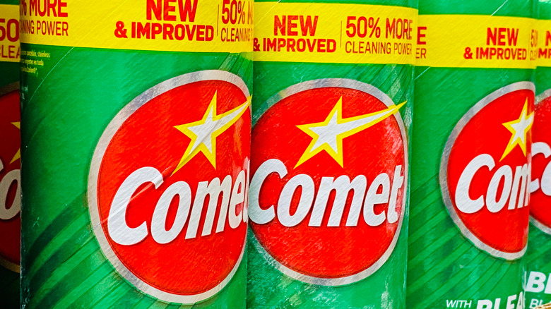 Three canisters of Comet bleach
