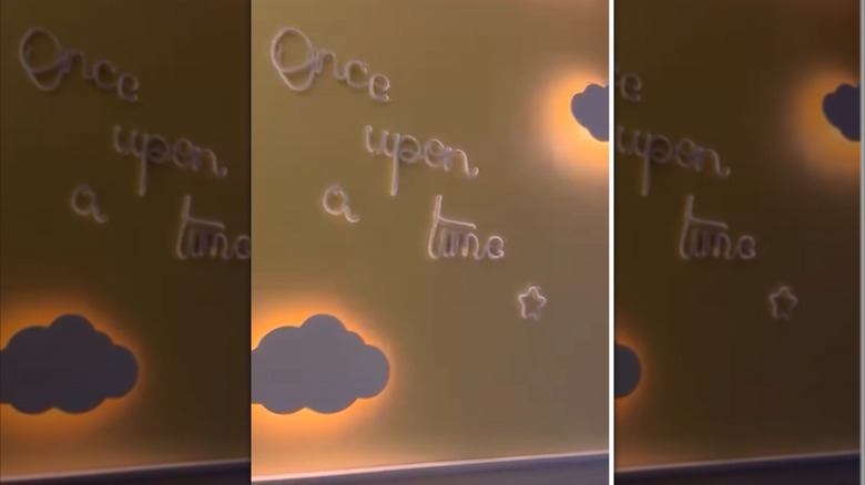 Clouds hanging on a wall are backlit by push lights