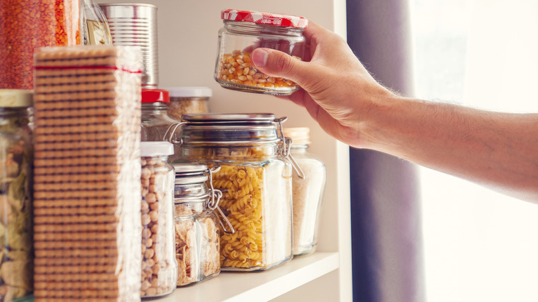 jars and dry goods on kitchen shelf