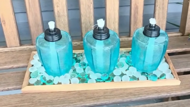 Woman using hot glue gun to make craft