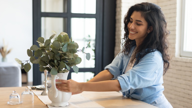 Woman with potted plant