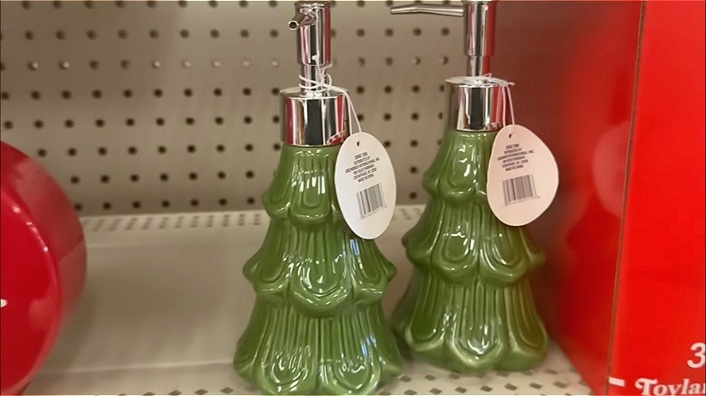green christmas tree shaped soap dispenser on a store shelf