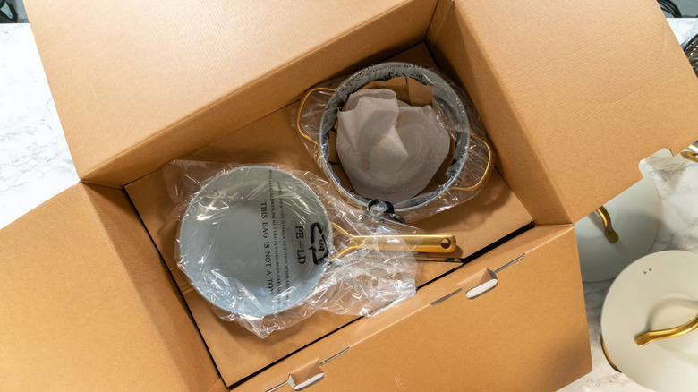 cookware packaged in cardboard box
