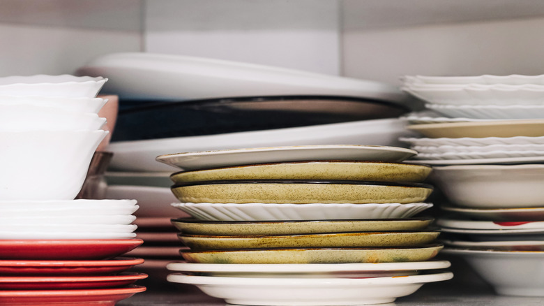 several stacks of clean plates organized on surface