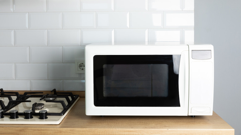 white microwave on countertop