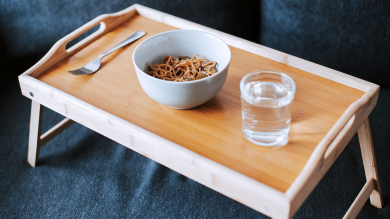A TV tray with lunch on it