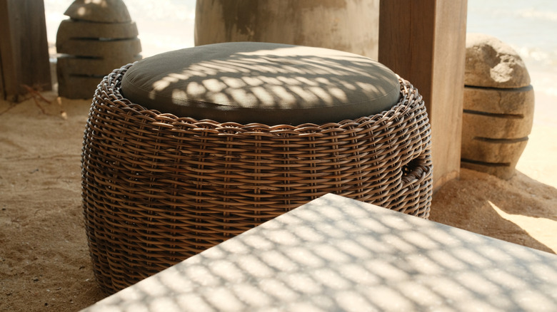 Rattan ottoman in outdoor setting