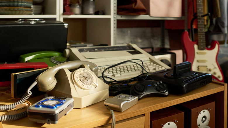 Assorted vintage electronics in a thrift store.