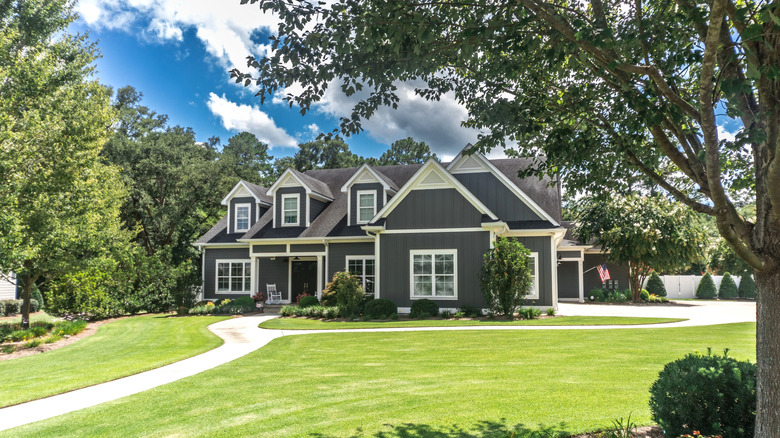 Gray modern home with landscaped yard