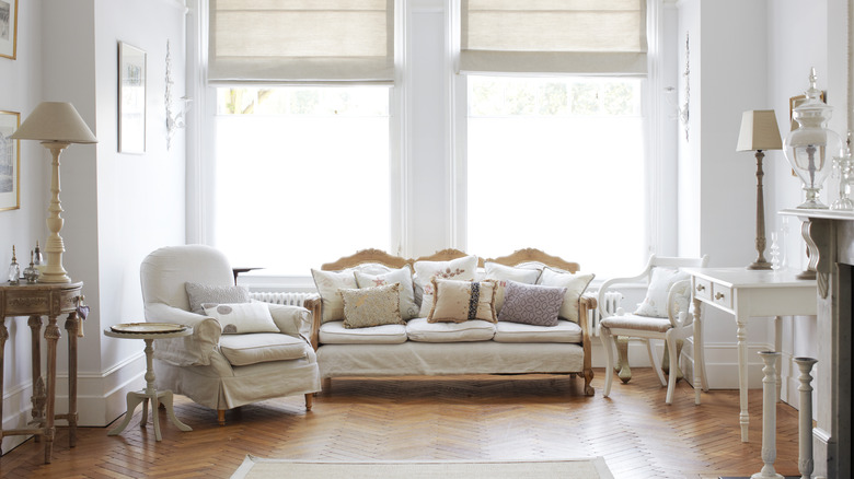 A home with throw pillows on a white sofa.