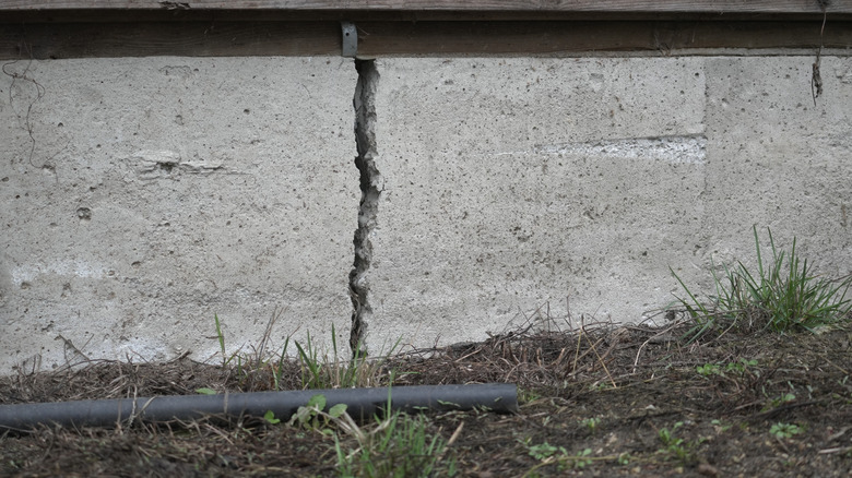 Close up of a deep foundation crack in house