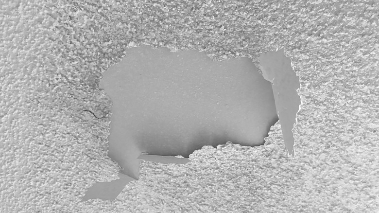A peeling popcorn ceiling