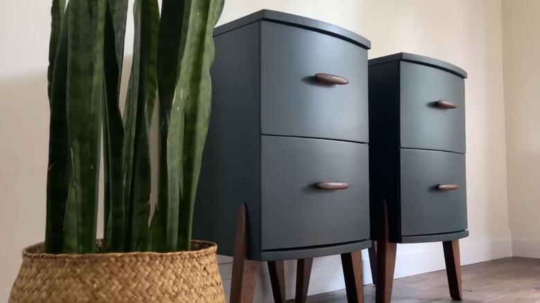 Two wooden nightstands that were created from a single vintage vanity.