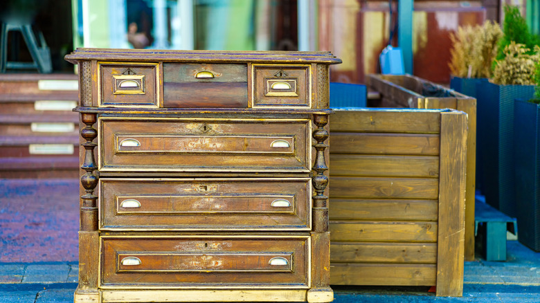 Old wooden dresser at a thrift store.