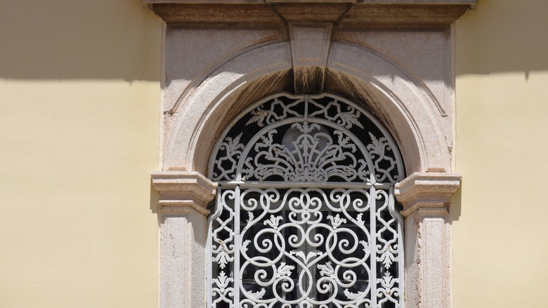 An antique Venetian-styled grille gate.