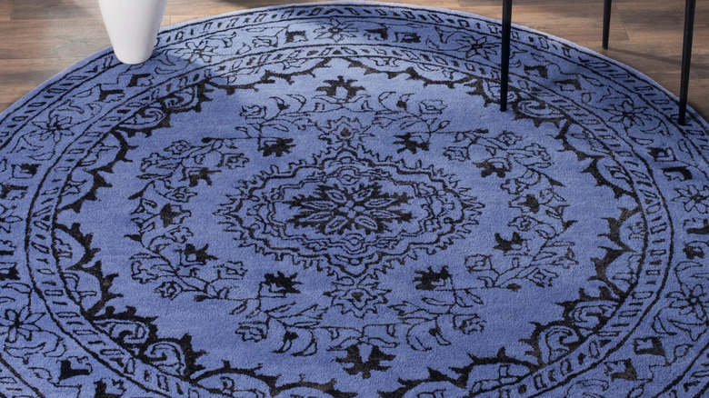 a blue and black viscose rug