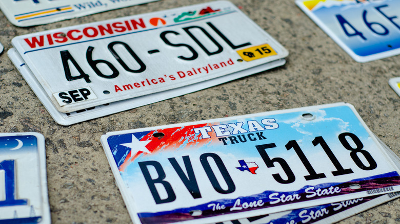 Stack of license plates on a granite counter