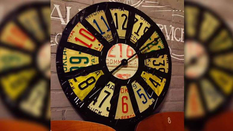 Round clock made from pieces of license plates