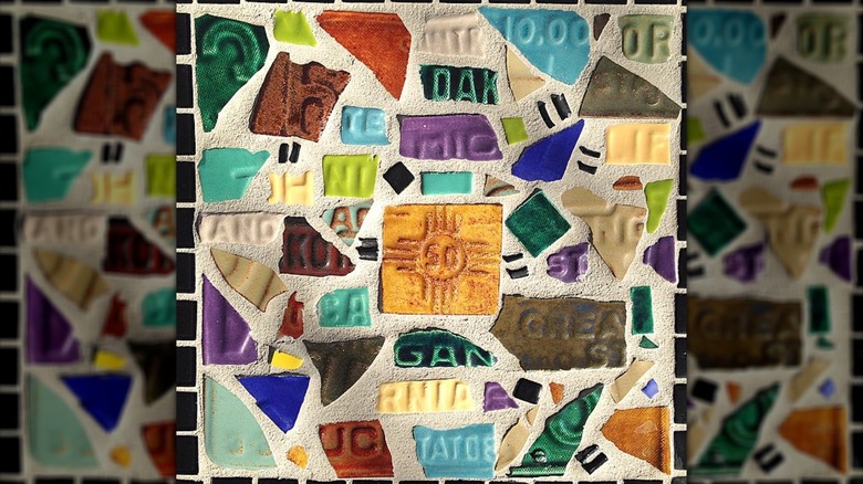 Closeup of a paving set with pieces of license plate set inside