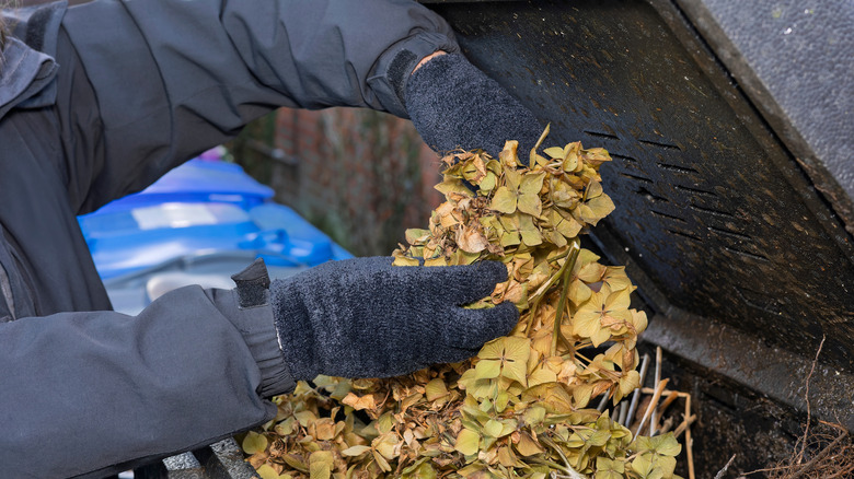 Composter adds vegetation to compost in the winter.