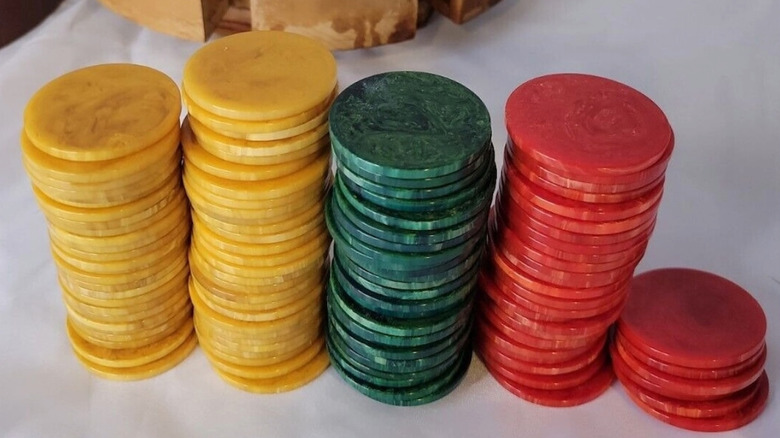 Stacks of Bakelite poker chips in yellow, green, and red