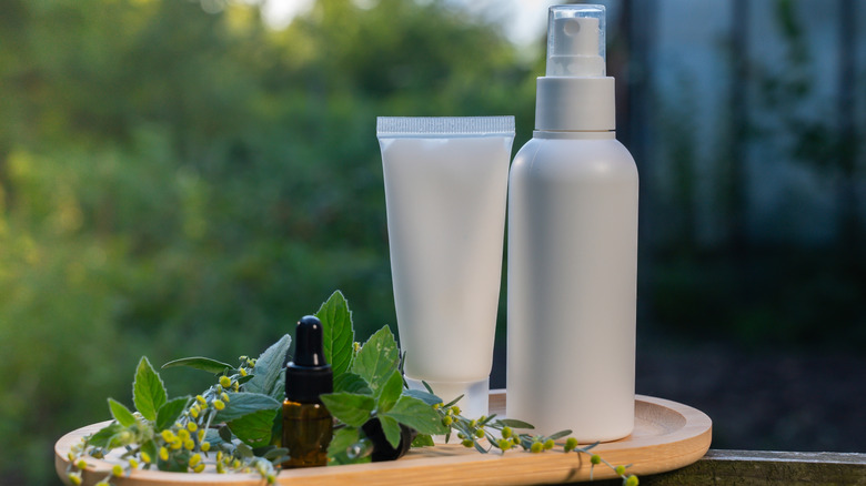 Bottle and tube of bug spray