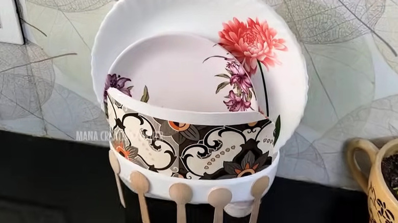 DIY dish rack made from a laundry detergent bottle