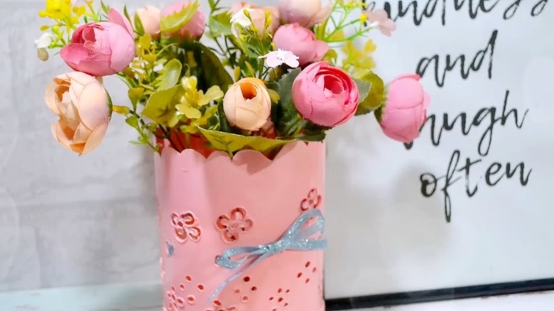 Pink flower vase made from old detergent bottle
