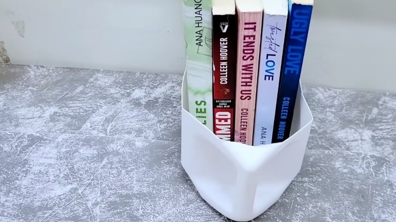 Sliding book storage shelf from a detergent bottle