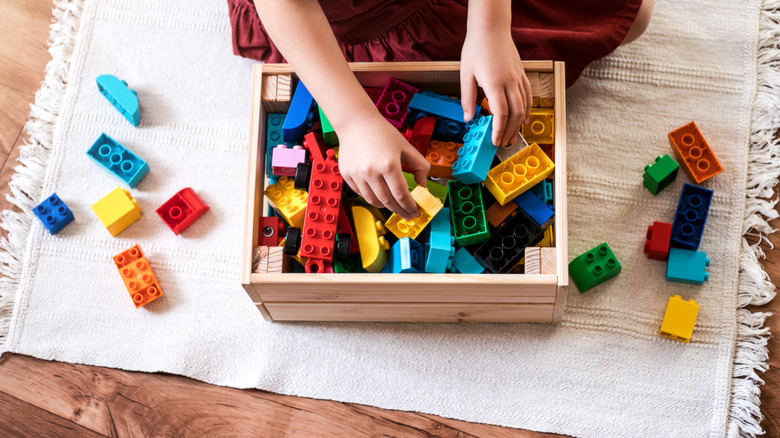 Child playing with building toys