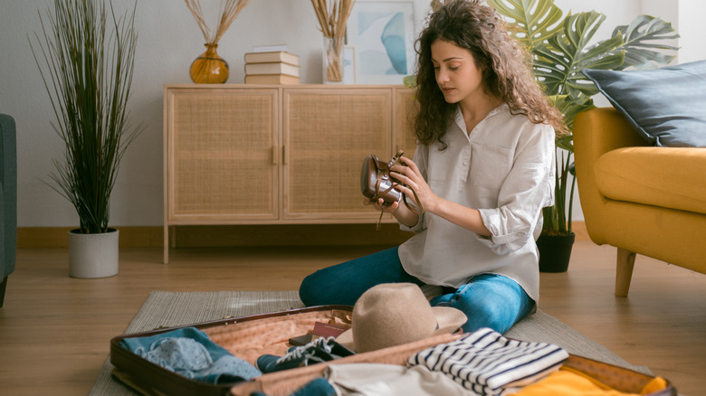 Woman packing her suitcase