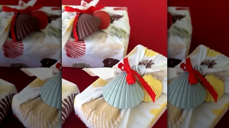 Gifts wrapped in old bed sheet with seashell print