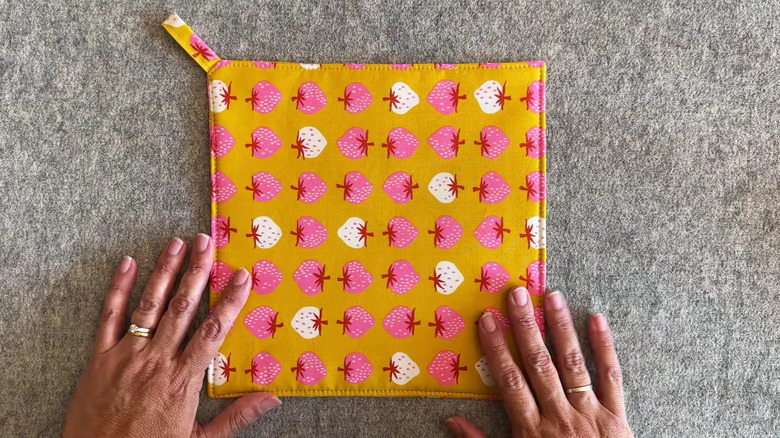 Homemade pot holder made from strawberry fabric